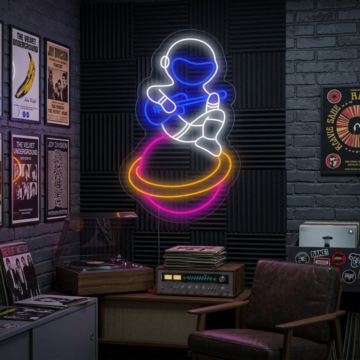 "Musician Spaceman Astronaut Sitting On Planet" Neon Sign